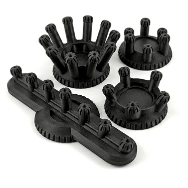 Set of black plastic components on a white background